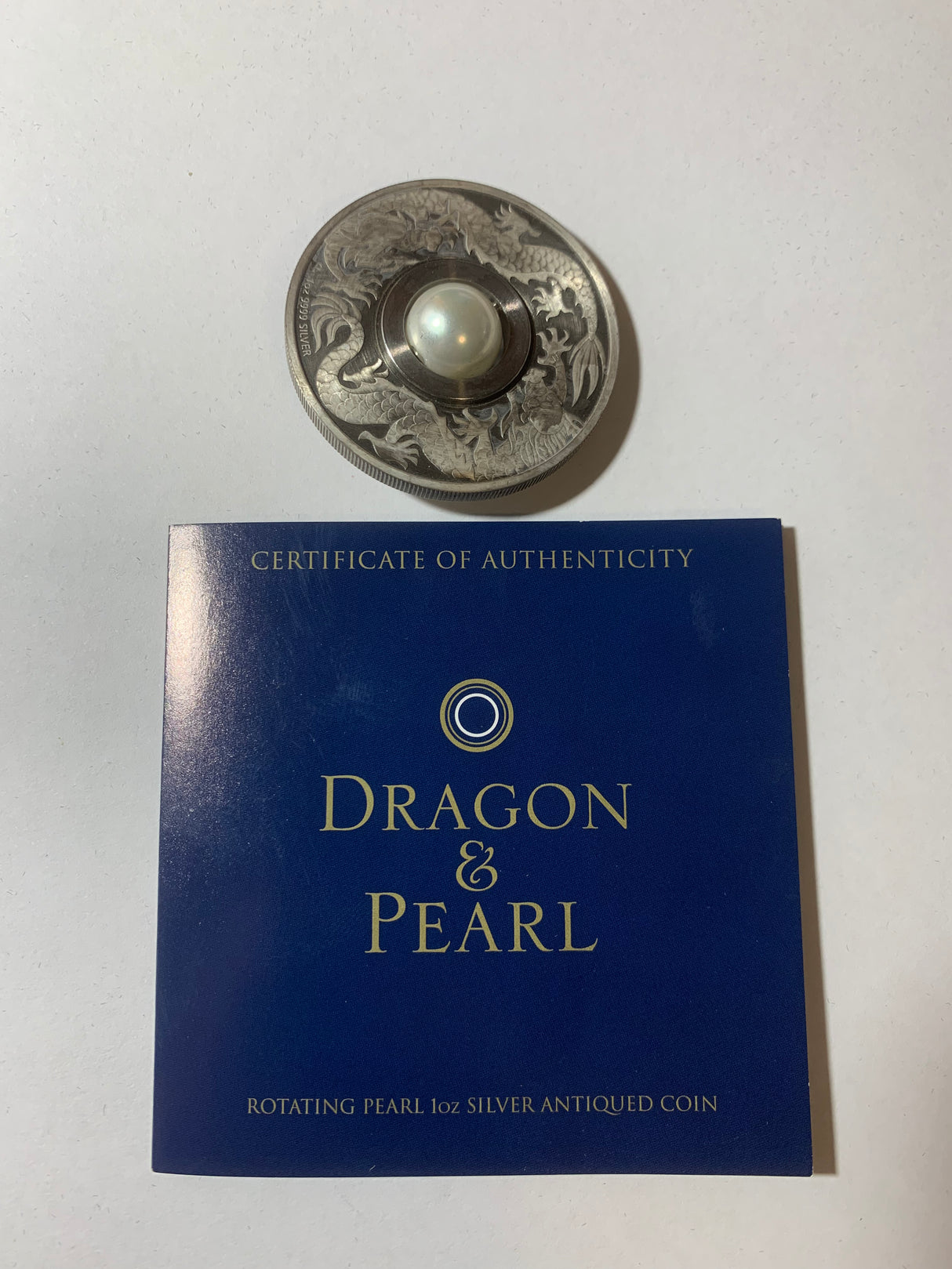 2017 $1 1oz Silver Antiqued Coin. Dragon and Pearl.