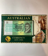 2000s $2 coin and banknote in folder