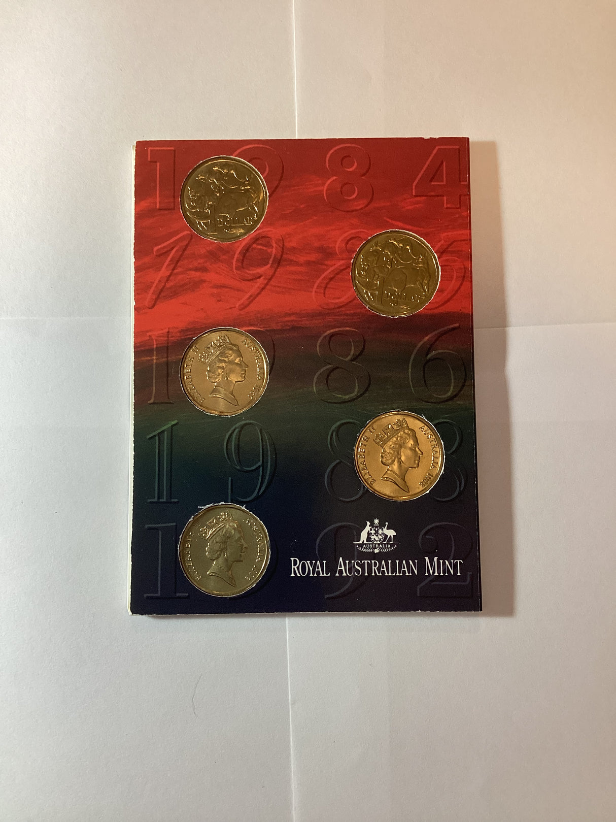 The Australian One Dollar Five coin set (has 1984, 1985, 1986, 1988, 1992). $1